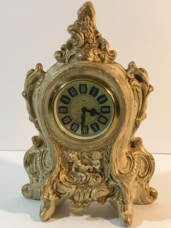 Photo 1 of VINTAGE LANSHIRE HOLLAND MOLD MANTLE CLOCK. H- 11”