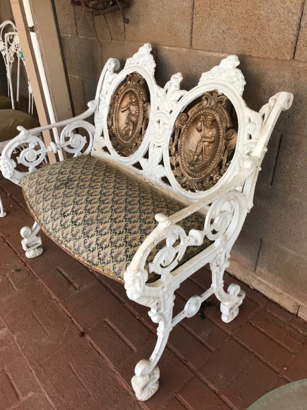 Photo 2 of ANTIQUE FRENCH CAST IRON GARDEN LOVESEAT/ BENCH WITH COLONIAL CHARACTER ART. W-36”, D-25”, H-36” (NOTE: SEAT NEEDS RESTORATION)