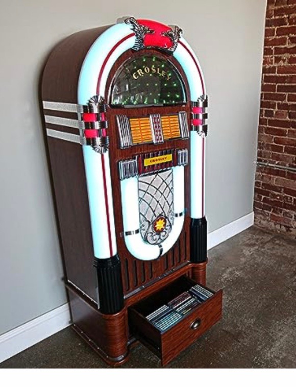 Photo 1 of CROSLEY CR1215A-WA JUKEBOX, INCLUDES AM/FM RADIO & BLUETOOTH RECEIVER & CD PLAYER WITH ST15-WA STAND INCLUDED - WALNUT
26”x16”x57”