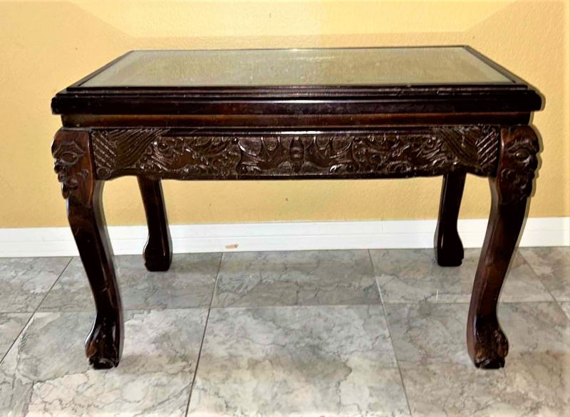 Photo 1 of CARVED WOOD TABLE WITH GLASS TOP, 24” x 13” H16.5”