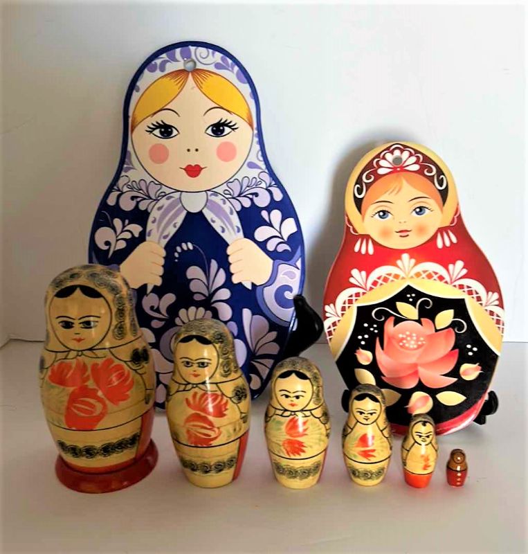 Photo 1 of RUSSIAN NESTING FOLLS AND TWO TRIVETS (STANDS NOT INCLUDED)