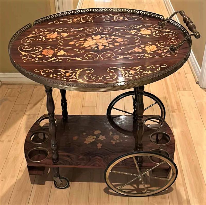 Photo 1 of VINTAGE ITALIAN SORRENTO WOOD DROP LEAF TABLE WITH INLAID COCKTAIL CART TABLE OPENED 30” ROUND CLOSED 30” x 17.5” x H27”
TABLETOP NEEDS GLUE)