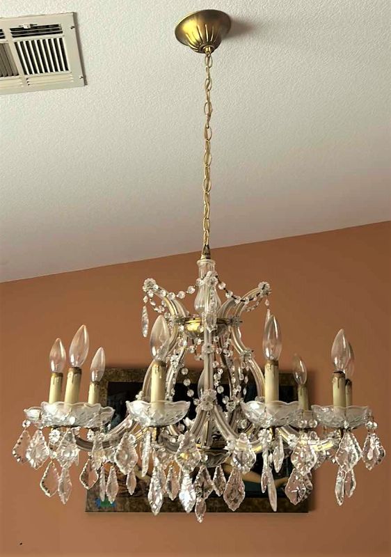 Photo 1 of VINTAGE CRYSTAL CHANDELIER W EXTRA CRYSTALS 28” x 21” (MEASUREMENT WITHOUT CHAIN)