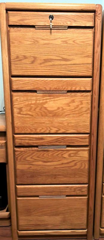 Photo 1 of SOLID WOOD LOCKING FILE CABINET WITH KEY 21” x 25” x H 55” includes file folders
