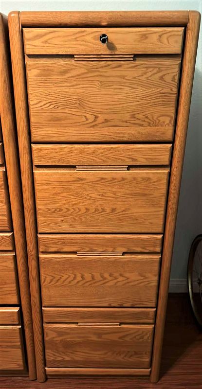 Photo 1 of SOLID WOOD LOCKING FILE CABINET WITH KEY 21” x 25” x H 55” includes file folders