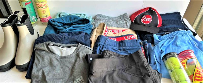Photo 1 of MENS CLOTHING ASSORTMENT BOOTS AND TENNIS BALLS ( PANTS SHORTS MOSTLY WAIST 38”)