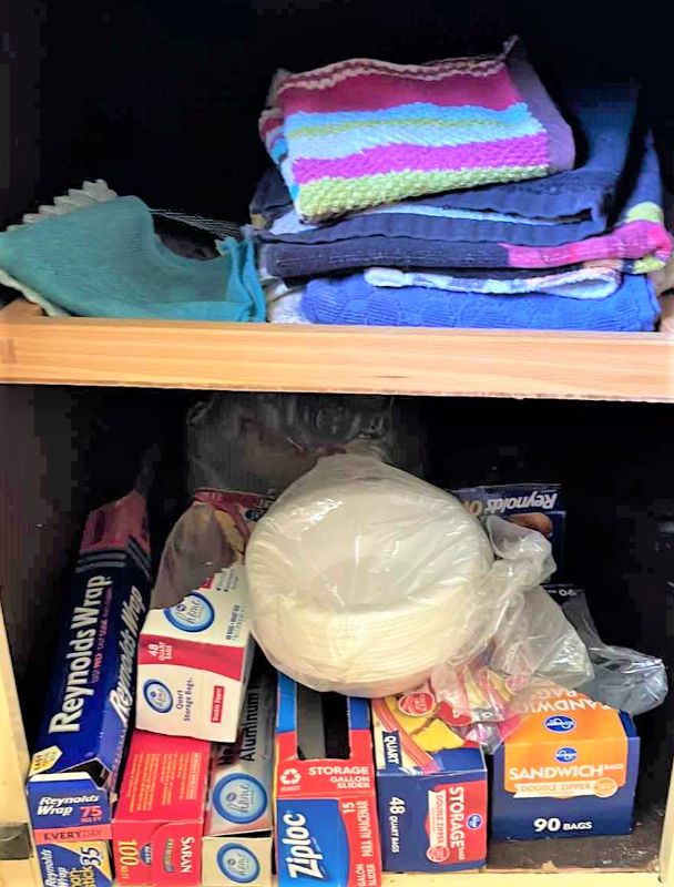 Photo 1 of CONTENTS OF CUPBOARD, DISHTOWELS, PLASTIC STORAGE BAGS