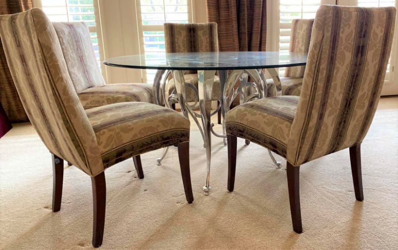 Photo 1 of ROUND BEVELED EDGE GLASS TABLE WITH SILVER METAL BASE AND 5 CHAIRS 54” H29” AND TABLE PROTECTOR