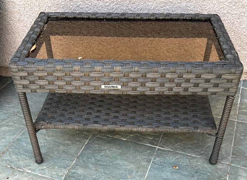 Photo 1 of STYLEWELL FAUX WICKER AND GLASS OUTDOOR COFFEE TABLE 30” x 18”