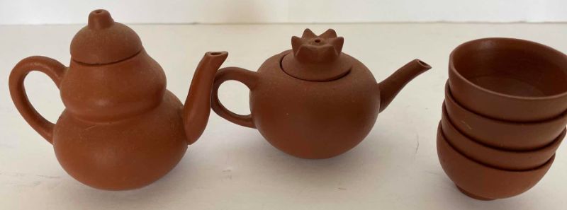 Photo 1 of PAIR OF VINTAGE CHINESE COLLECTIBLE CLAY TEA POTS WITH 4 TEA CUPS LARGEST TEAPOT 3 1/4” x 1 3/4”