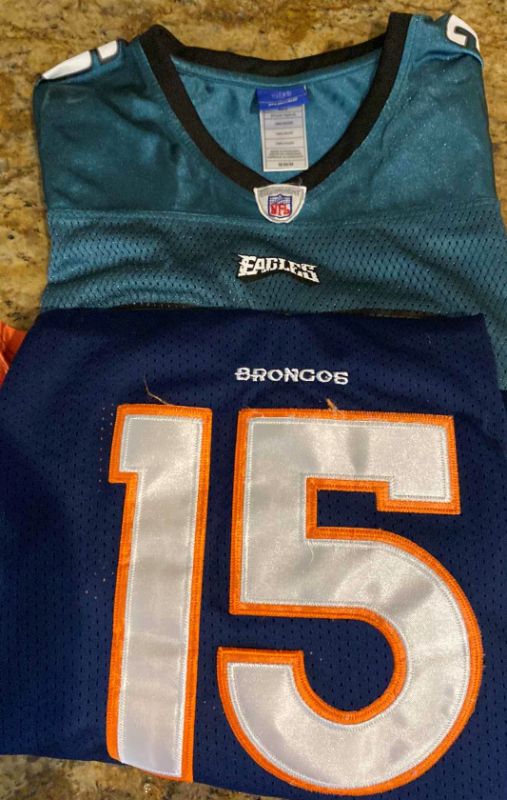 Photo 1 of 2-NFL MENS SIZE MEDIUM BRONCOS AND EAGLES JERSEYS