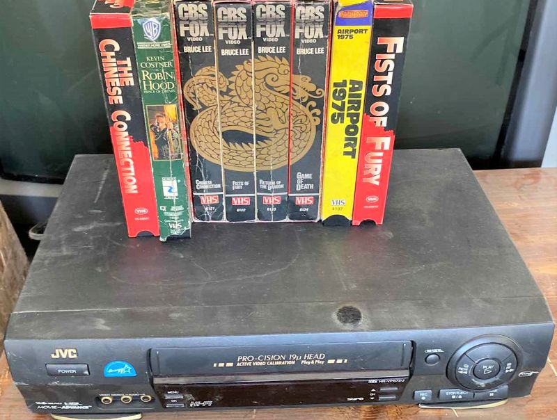 Photo 1 of JVC VCR AND ASSORTED ACTION MOVIES