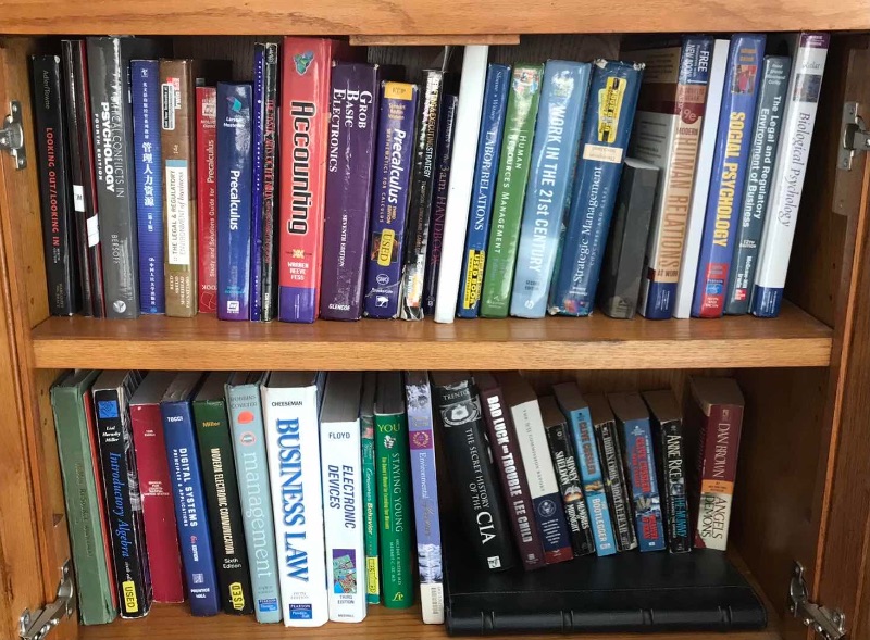 Photo 1 of 2 SHELVES OF BOOKS - CABINET NOT INCLUDED 
