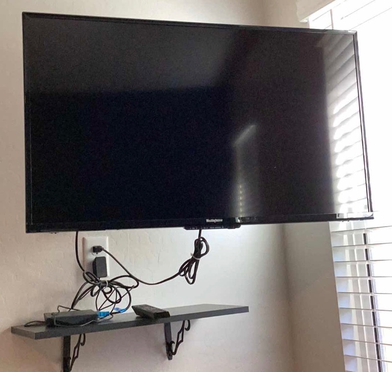 Photo 1 of WESTINGHOUSE FLATSCREEN TV 40” WITH SWIVEL WALL MOUNT - BUYER TO REMOVE.