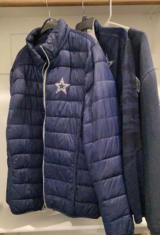 Photo 1 of DALLAS COWBOYS JACKET AND OTHER MERCHANDISE 3 PAIR SIZES VARY FROM L TO XL.