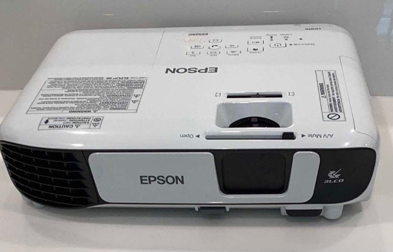 Photo 2 of EPSON LCD PROJECTOR INCLUDES POWER CORD, REMOTE, INSTRUCTIONS, AND BATTERIES FOR REMOTE.