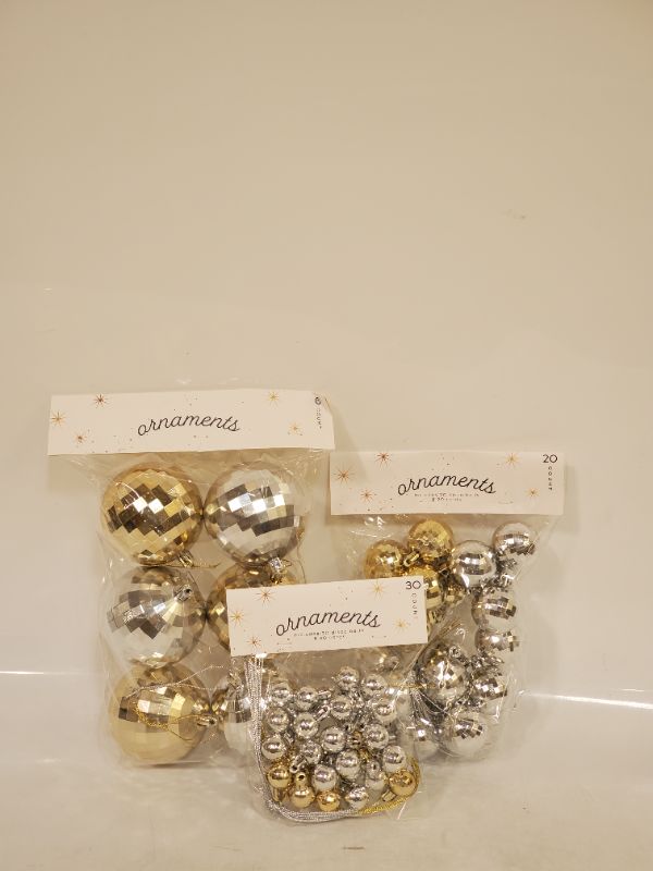 Photo 1 of 6 LARGE, 20 MEDIUM, AND 30 SMALL CHRISTMAS  ORNAMENTS- COLORS GOLD AND SILVER 