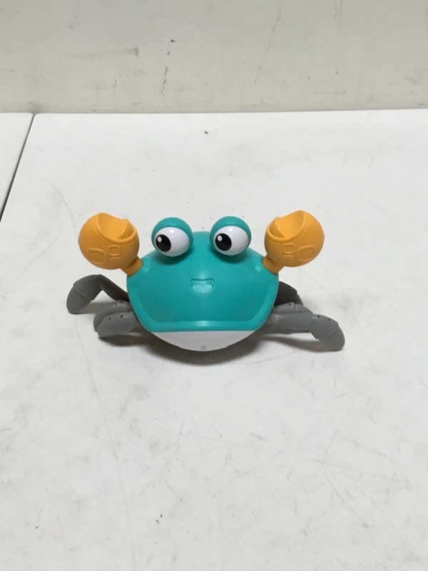 Photo 2 of Tipmant Baby Toddler Crab Toys for Kids Interactive Electric Animal Toy with Crawling, Sensing Obstacles, Glowing Eyes, Play Music Functions (Blue)

