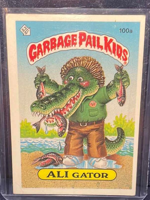 Photo 1 of 1986 GARBAGE PAIL KIDS ALI GATOR CARD #100a