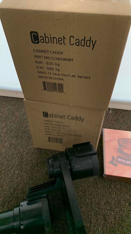 Photo 1 of CABINET CADDYS, KCUP HOLDERS,PUZZLES, AND A DUAL AUTO BEVERAGE HOLDER