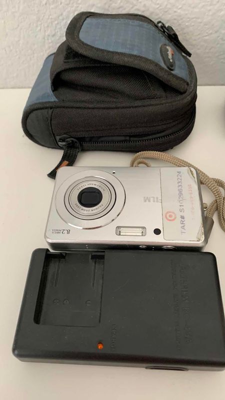 Photo 1 of FUJIFILM FINEPIX J10, BATTERY CHARGER AND A BELL HOWELL 985D CAMERAS