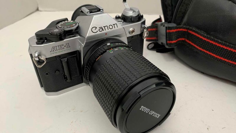 Photo 1 of VINTAGE CANON AE-1 CAMERA AND CASE