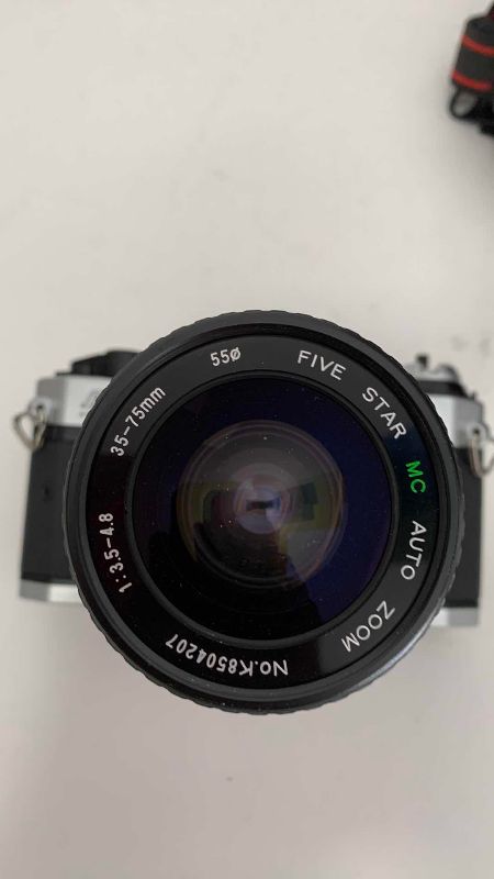 Photo 1 of VINTAGE CANON AE-1 CAMERA AND CASE