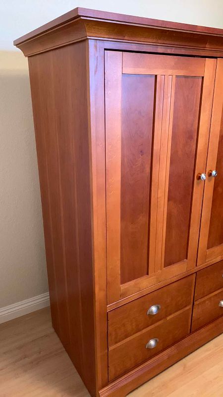 Photo 1 of WOODEN TELEVISION CABINET 48 X 25” H 62”