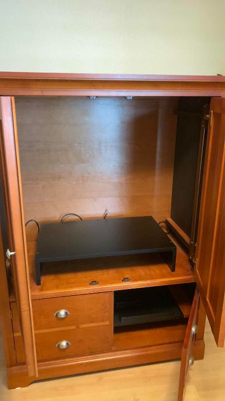 Photo 1 of WOODEN TELEVISION CABINET 48 X 25” H 62”