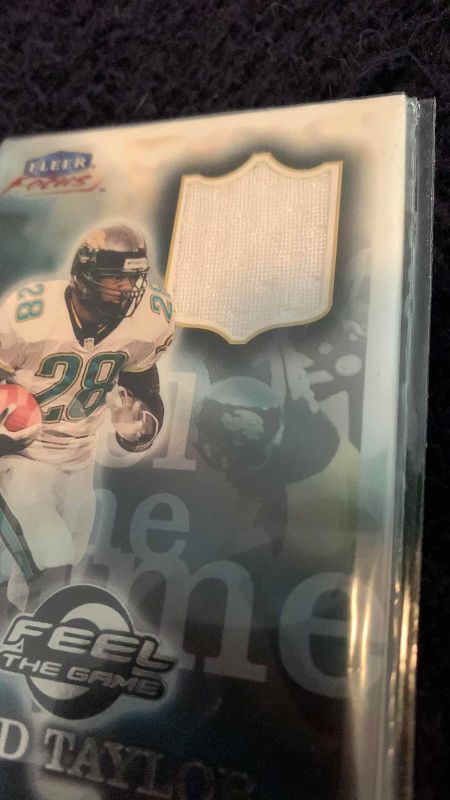 Photo 1 of 1999 NFL FOOTBALL FLEER FRED TAYLOR FEEL THE GAME JERSEY CARD
