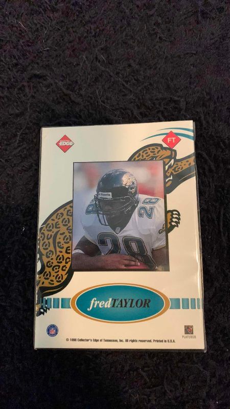 Photo 1 of 1998 NFL FOOTBALL COLLECTORS EDGE FRED TAYLOR GAME USED FOOTBALL CARD