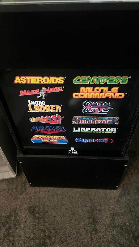 Photo 1 of ARCADE 1UP ATARI CLASSICS STAND UP ARCADE GAME: ASTEROIDS, CENTIPEDE, MISSLE COMMAND, LUNAR LANDER, TEMPEST, AND MORE 19” X 23” H 59”