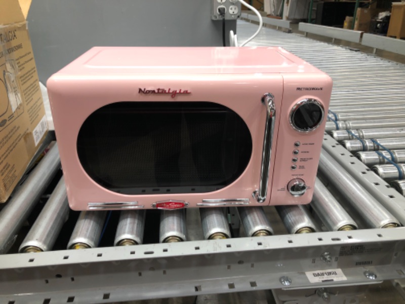 Photo 2 of Nostalgia Retro 0.7 Cubic Foot 700-Watt Countertop Microwave Oven, Cu. Ft, Pink
