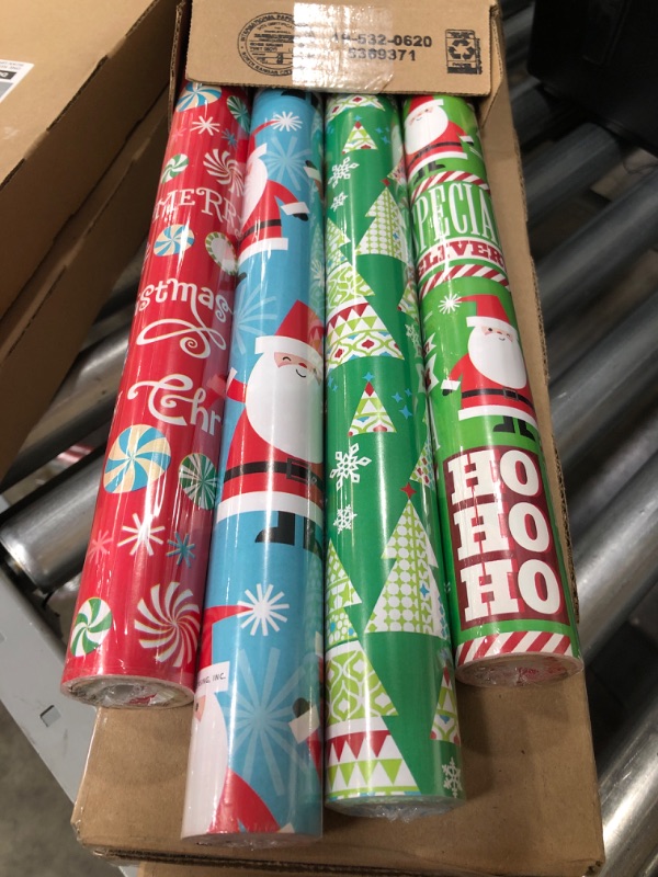 Photo 2 of **SET OF 8** Hallmark Reversible Christmas Wrapping Paper Bundle for Kids (Pack of 4, 150 sq. ft. ttl.) Candy Canes, Santa, Trees, Red, Blue, Green
