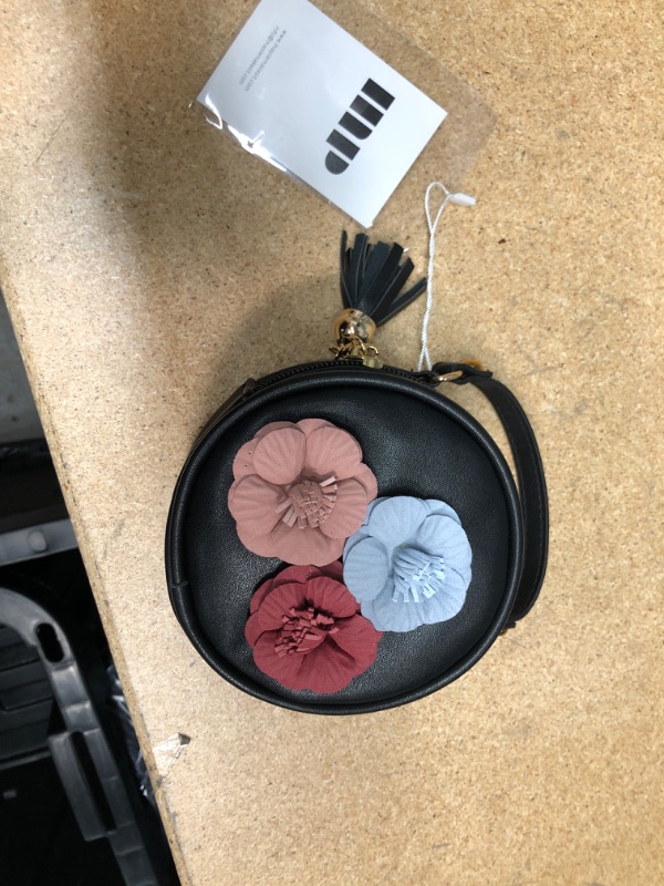 Photo 1 of Circled black purse with three flowers