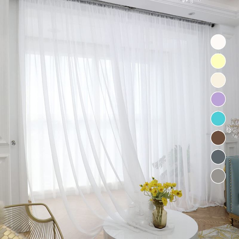 Photo 1 of 2 Pack White Sheer Curtains 63 Inches Long 2 Panels,Rod Pocket Voile Semi Sheer Window Curtains for Kitchen, Bedroom and Living Room(White, 52 W x 63 L)
