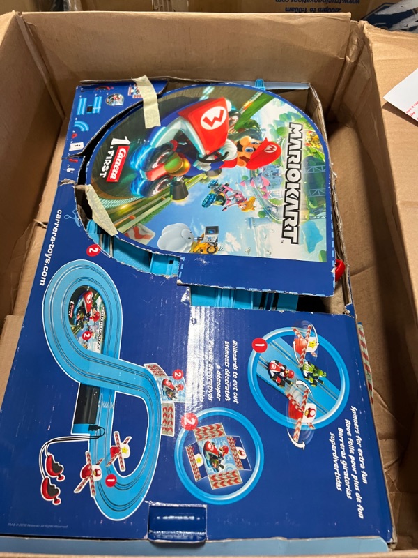 Photo 3 of Carrera First Mario Kart - Slot Car Race Track With Spinners - Includes 2 Cars: Mario and Yoshi - Battery-Powered Beginner Racing Set for Kids Ages 3 Years and Up
