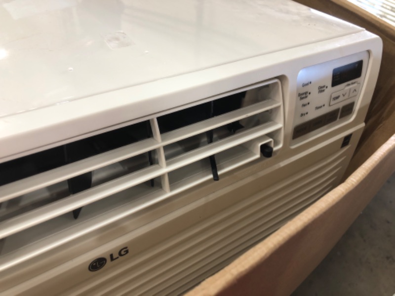 Photo 1 of LG 11,800 BTU Through-The-Wall Remote, Cools up to 530 Sq. Ft, Energy Star, 3 Cool & Fan Speeds, Universal Design fits Most Sleeves, 115V Air Conditioner, 12000, White
DOES NOT BLOW COLD AIR AND MAKES SOME TYPE OF NOISE