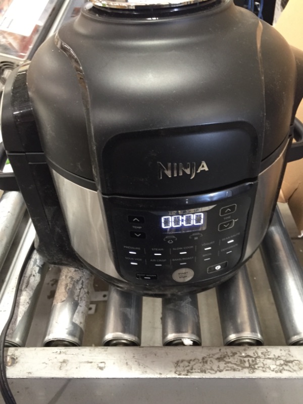 Photo 1 of Ninja FD302 Foodi 11-in-1 Pro 6.5 qt. Pressure Cooker & Air Fryer that Steams, Slow Cooks, Sears, Sautés, Dehydrates & More, with 4.6 qt. Crisper Plate, Nesting Broil Rack, Silver/Black