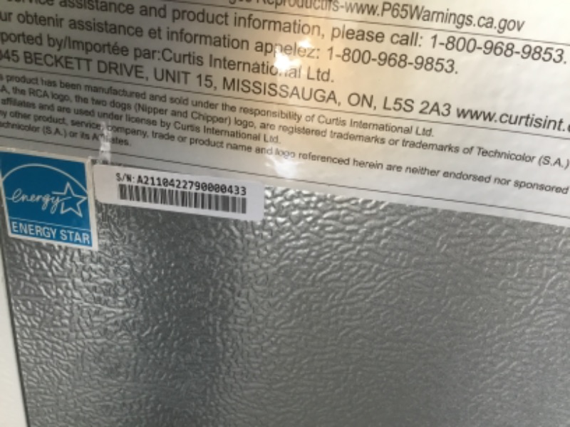 Photo 4 of RCA 3.2 Cu Ft Single Door Mini Fridge with Freezer, White freon line is broken and door doesnt close properly
