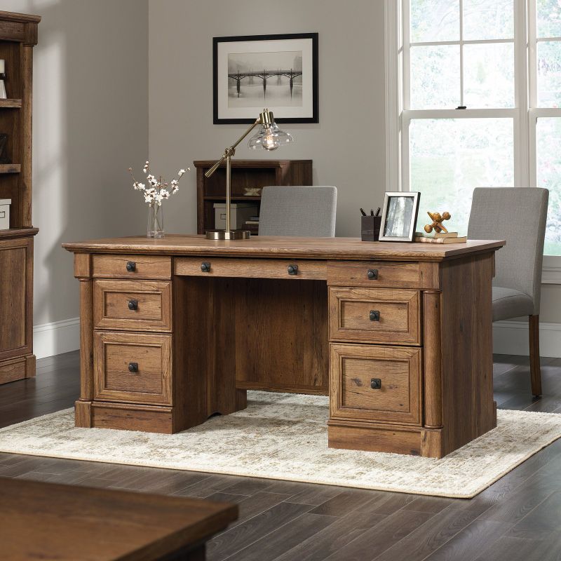 Photo 1 of (INCOMPLETE)
(BOX1OF2)
(REQUIRES BOX2 FOR COPMLETION)
SAUDER 66 in. Rectangular Vintage Oak 6 Drawer Executive Desk with Keyboard Tray