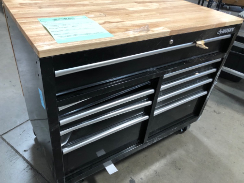 Photo 8 of (MISSING KEYS; MAJOR DAMAGE TO BASE/TOP) 
Husky 46 in.W x 51 in. D Standard Duty 9-Drawer Mobile Workbench with Solid Top Full Length Extension Table in Black