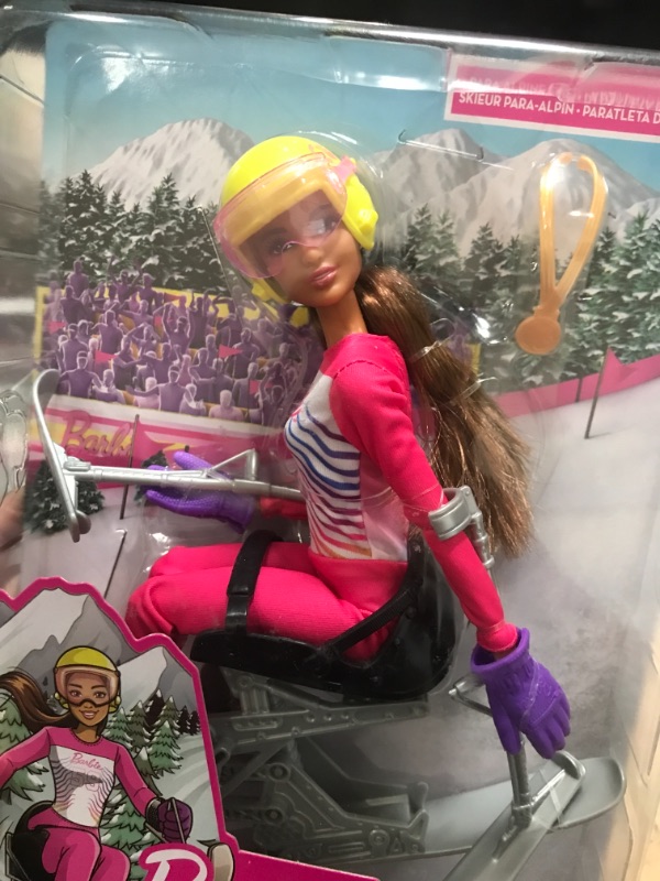 Photo 3 of Barbie Winter Sports para Alpine Skier Brunette Doll (12 in) with Shirt, Pants, Helmet, Gloves, Pole, Sit Ski & Trophy, Great Gift for Ages 3 and Up
