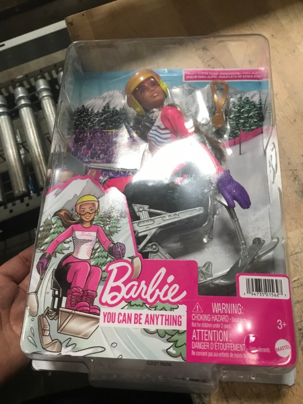 Photo 2 of Barbie Winter Sports para Alpine Skier Brunette Doll (12 in) with Shirt, Pants, Helmet, Gloves, Pole, Sit Ski & Trophy, Great Gift for Ages 3 and Up
