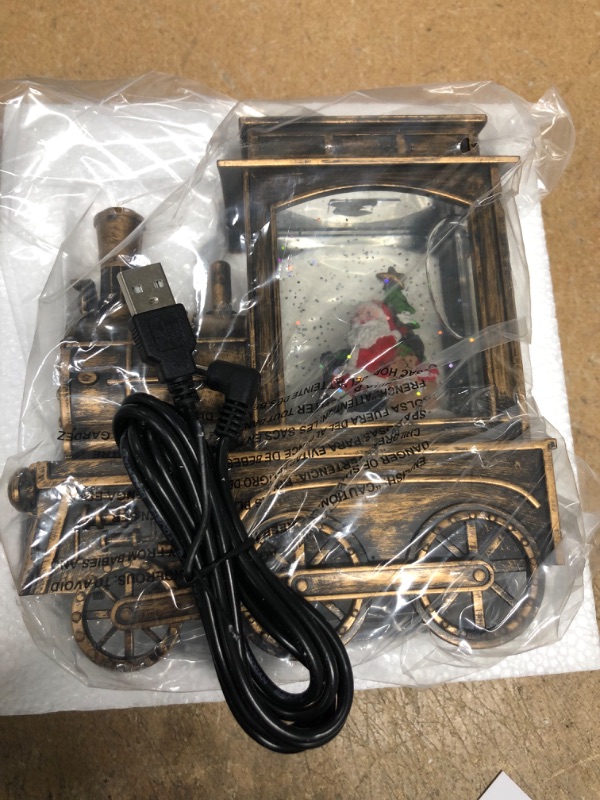Photo 1 of GenSwin Music Lighted Train Snow Globe Lantern Water Snowing Glittering Battery Operated with Timer, Christmas Santa Claus Musical Lighted Home Decoration and Gift (Copper)