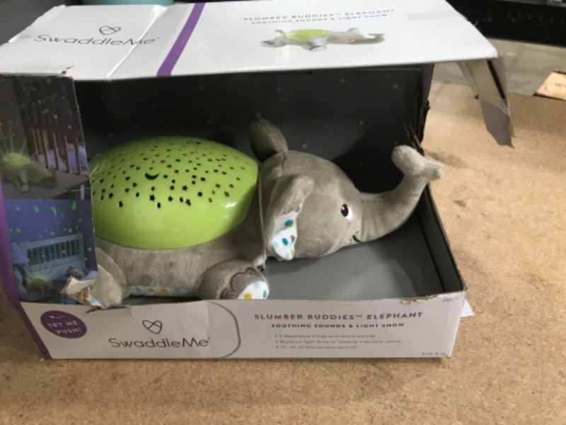 Photo 2 of SwaddleMe® Slumber Buddies® Soother (Gray/Green Elephant) – Projector Night Light for Kids with Calming Songs and Sounds
