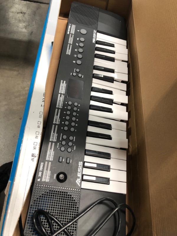 Photo 2 of damaged keyboard**
Alesis Melody 32 – Electric Keyboard Digital Piano with 32 Keys, Speakers, 300 Sounds, 300 Rhythms, 40 Songs, USB-MIDI Connectivity and Piano Lessons
