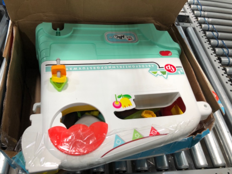 Photo 1 of Fisher-Price Laugh & Learn On-the-Go Camper, Musical Push-Along Walker and Activity Center for Infants and Toddlers Ages 9-36 Months, Multi color, 3 Smart Stages in 1
