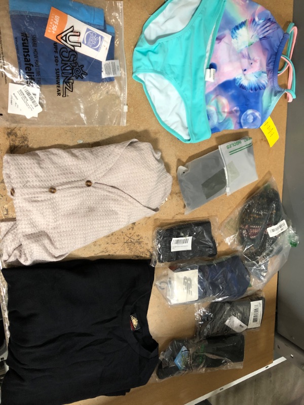 Photo 1 of **NON-REFUNDABLE** Assorted Amazon Clothing, Men's Socks and Shirts 9-13, L, Women's Shirts and Socks, Boys Sun Shirt, 4T and Girls Swimsuit Two-Piece XL 