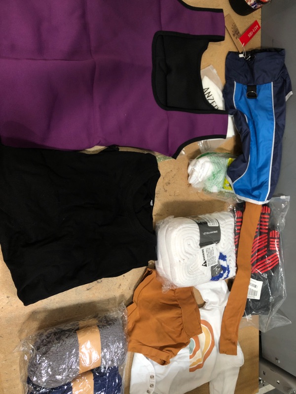 Photo 1 of **NON-REFUNDABLE** Assorted Amazon Clothing, Men's Socks and Shirts 9-13/xxl, Women's Sweat Tank L, Socks M-L, Dog Clothes S, and baking gloves 
